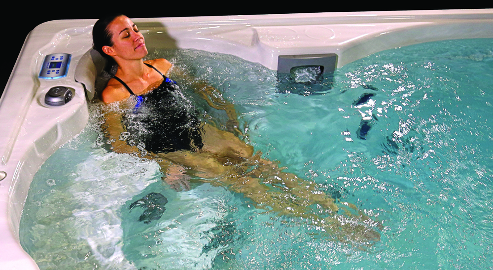 woman doing hydromassage in swimlife swim spa