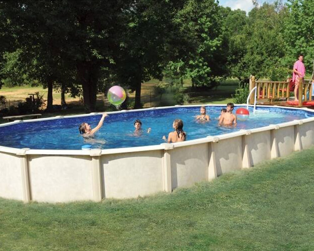 family throwing ball in Doughboy above ground pool